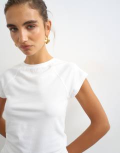 Model wearing Raglan clean t shirt in white