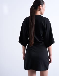 Model wearing Raglan sleeve cinch waist mini dress in black