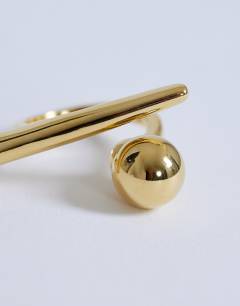 Model wearing Ramona waterproof abstract ring in stainless gold