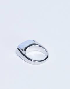 Model wearing Raquel stainless steel blue stone ring in silver