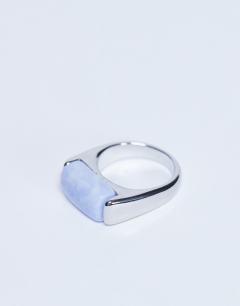 Model wearing Raquel stainless steel blue stone ring in silver