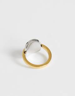 Model wearing Ravi waterproof  stainless steel ring in silver with gold detail