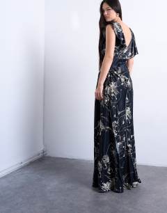Model wearing Raw seemed frill maxi dress in mono winding floral