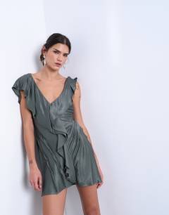 Model wearing Raw seemed frill mini dress in petrol