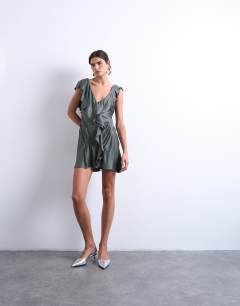 Model wearing Raw seemed frill mini dress in petrol