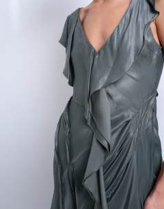 Model wearing Raw seemed frill mini dress in petrol