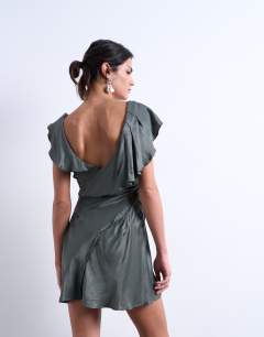 Model wearing Raw seemed frill mini dress in petrol