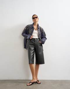 Model wearing Real leather beaded jacket in blue