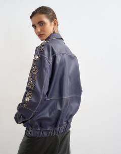 Model wearing Real leather beaded jacket in blue