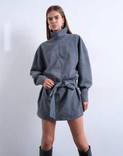 Model wearing Real suede funnel neck cinch waist long sleeve mini dress in petrol blue