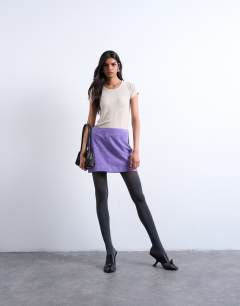 Model wearing Real suede pelmet mini skirt in purple