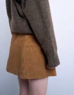 Model wearing Real suede seamed mini skirt in toffee