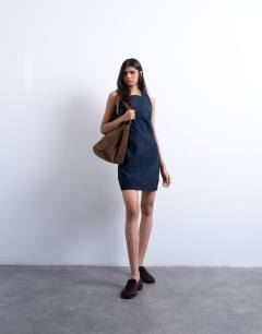 Model wearing Real suede square neck halter neck mini dress in navy