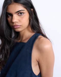 Model wearing Real suede square neck halter neck mini dress in navy