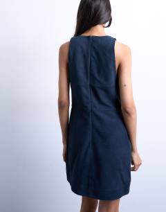 Model wearing Real suede square neck halter neck mini dress in navy