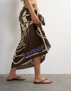 Model wearing Rectangle sarong in chocolate shell print