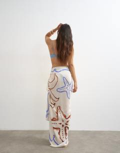 Model wearing Rectangle sarong in off white shell print