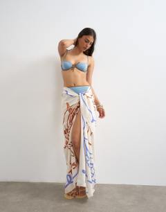 Model wearing Rectangle sarong in off white shell print