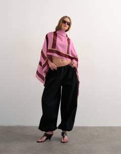 Model wearing Rectangle sarong in pink and burgundy stripe print
