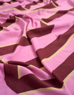 Model wearing Rectangle sarong in pink and burgundy stripe print