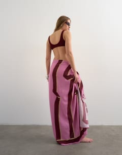Model wearing Rectangle sarong in pink and burgundy stripe print