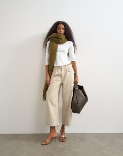Model wearing Relaxed mid rise crop jean in oat