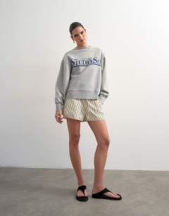 Model wearing Relaxed Studio 6 graphic sweatshirt