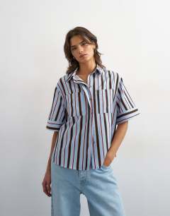 Model wearing Resort boxy shirt in blue stripe