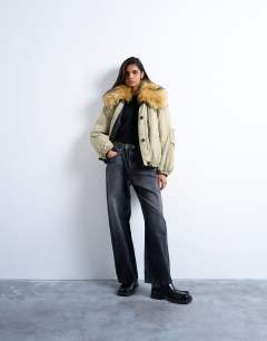 Model wearing Reversible fur collar hybrid bomber in green