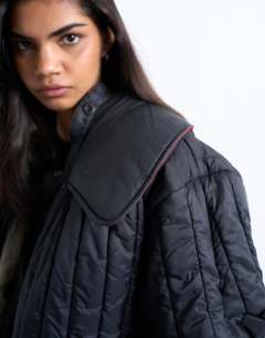 Model wearing Reversible fur collar hybrid bomber in green
