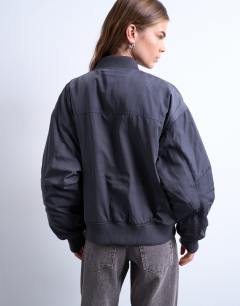 Model wearing Rib bomber jacket in slate