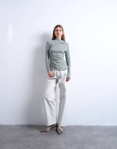 Model wearing Rib high neck long sleeve top in beige