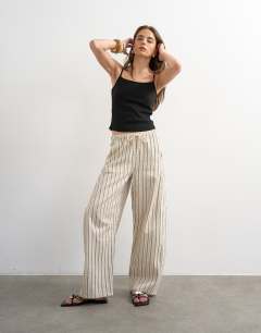 Model wearing Rib micro curve hem strappy vest in black