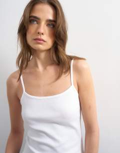Model wearing Rib micro curve hem strappy vest in white
