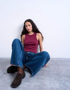 Model wearing Rib racer vest in burgundy