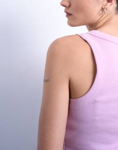 Model wearing Rib racer vest in pink