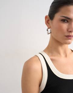 Model wearing Rib scoop neck vest in black and ecru