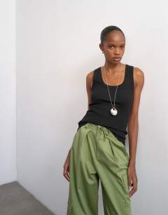 Model wearing Rib scoop neck vest in black