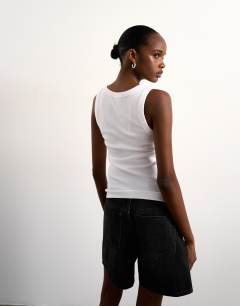 Model wearing Rib scoop neck vest in white