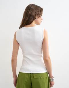 Model wearing Rib v-neck vest in white