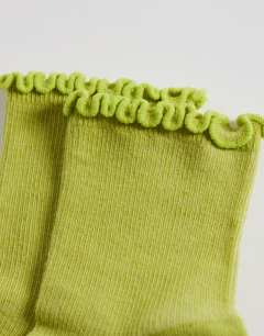 Model wearing Ribbed frill socks in lime