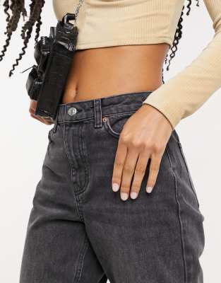 washed black ripped mom tapered jeans