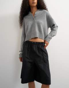Model wearing Ripstop short with toggle detail in black