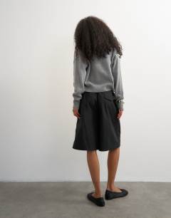 Model wearing Ripstop short with toggle detail in black