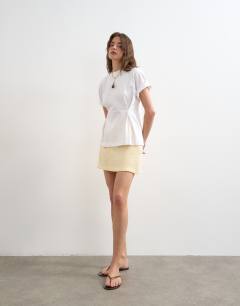 Model wearing Roll sleeve cinch tee in white