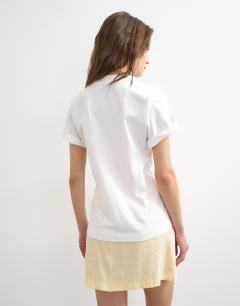 Model wearing Roll sleeve cinch tee in white