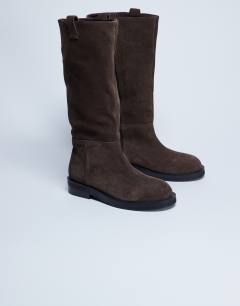 Model wearing Rory real suede leather riding boots in chocolate