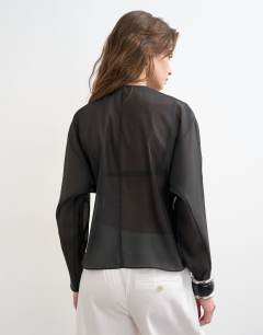 Model wearing Round neck organza top in black