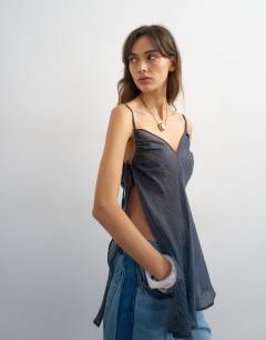 Model wearing Ruched armhole tie side tunic in navy