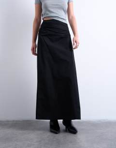 Model wearing Ruched asymmetric midi skirt in black 